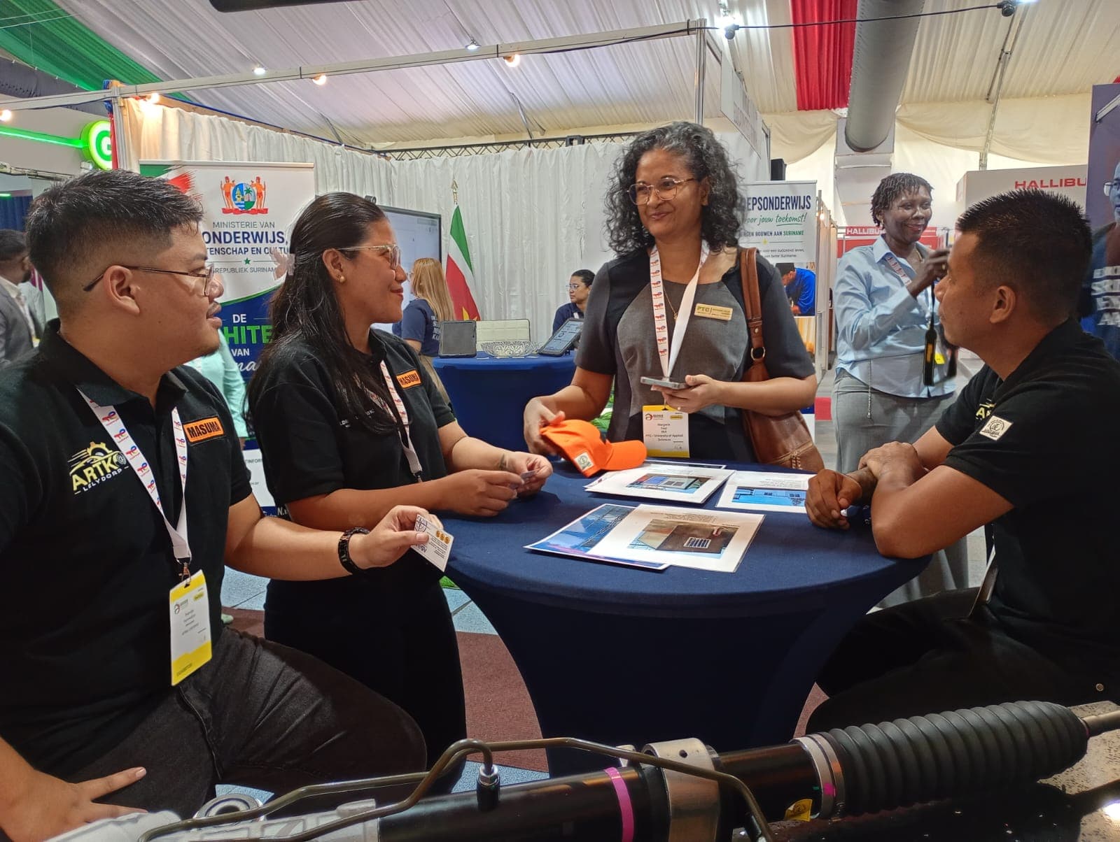 Attendees browsing brochures
